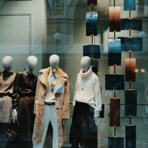 Stylish window display with modern fashion on mannequins. Perfect for showcasing boutique elegance.